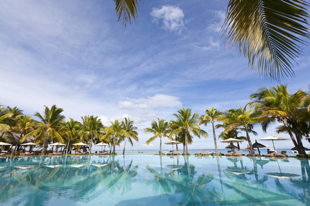 Swimming pool of five stars luxurious holiday resort on Mauritius. Favorite destnation honeymoon.の写真素材