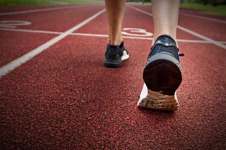 Sport backgrounds. Sprinter starting on the running trackの写真素材