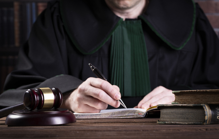 business or legal agreement signed in the presence of a lawerの写真素材