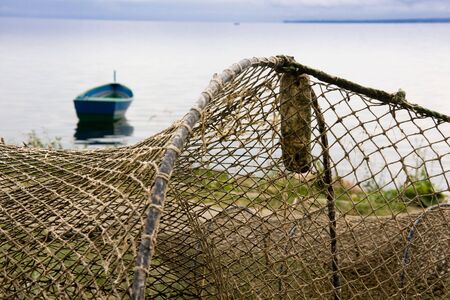 Old fishing nets drying on a sea shore