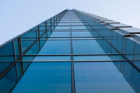 High-rise blue office building with dimishing perspective