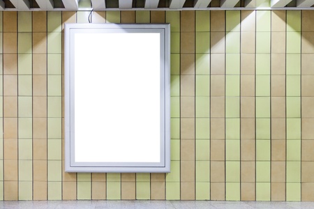 Blank billboard on a wall in subway underground with copy space 