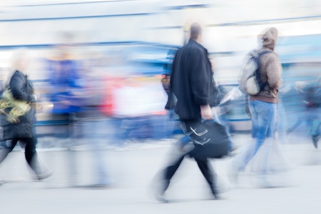 Blurred image of businessman rushing to office in the morning Blurred image of businessman rushing to office in the morning