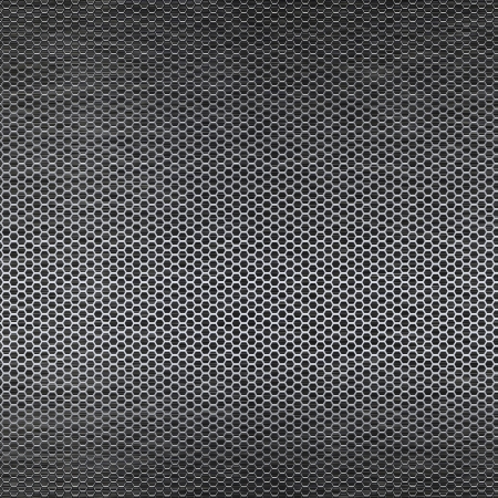 Metal mesh texture background over brushed metal sheetの写真素材