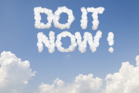 Do it now concept text words in clouds on blue skyの写真素材