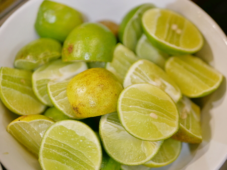 Selective focus and close up of slices of fresh limesの写真素材