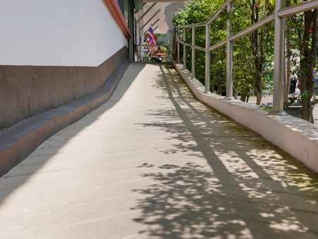 Concrete wheelchair ramp or uphill walkwayの写真素材