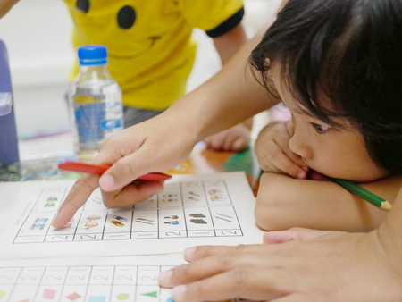 Little Asian baby girl, 37 months old, learning to count numbers at home - homeschool for preschool babiesの写真素材