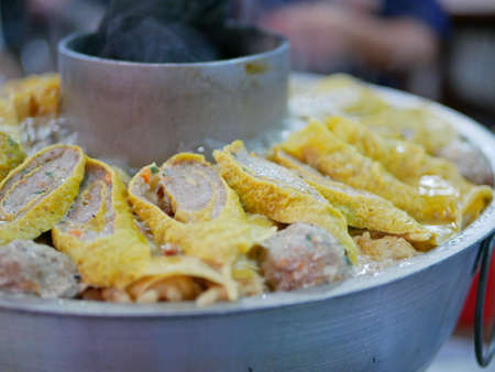 Big cooking hot pot with hot charcoals in the middle, originally from Yunnan, China, adapted and...