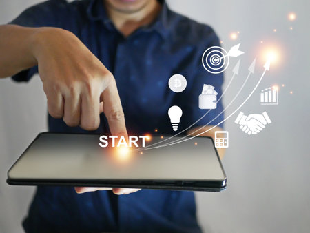 Startup business growing to success, finger tapping on a tablet with launching and pointing up...