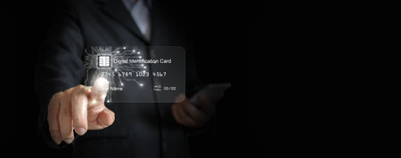 Digital ID card, Electronic Identification. e-ID smartcard, a digital solution for proof of identity. A businessman touches, and activates the card. Technology and businessの写真素材