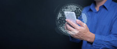Whole world in your hands concept. Digital globe with network connection surrounding a man's...