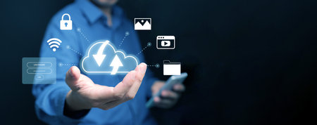 Cloud computing concept. A man with cloud computing service enables him to access photos, videos,...