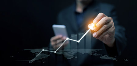 Hand with light arrow pointing rising chart, representing business growth, innovation, investment,...