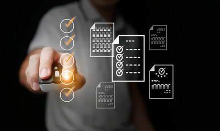 Hand using mouse to point checklist with virtual documents, illustrating business planning, project management, and productivity strategy in digital workplace solutions.の写真素材