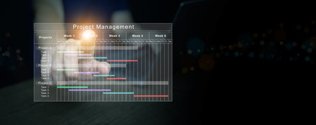 Digital project management concept showing business technology, task scheduling, data visualization with glowing touch interface for planning, coordination, productivity improvement.の写真素材