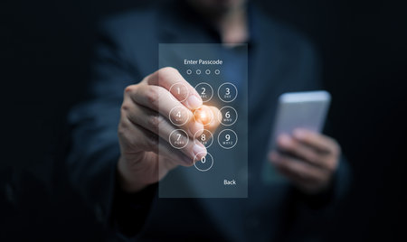 Close-up of man using virtual touchscreen keypad to unlock smartphone, concept of cybersecurity, secure access, digital data protection, and technology innovation in modern communication.の写真素材