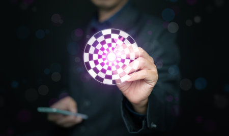Hand with a dart touching virtual target icon symbolizing focus, achievement, and vision in digital...