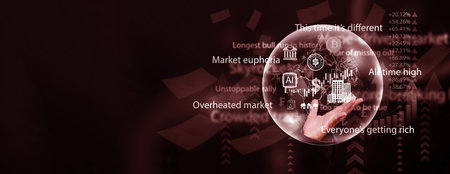 Hand holding a glowing bubble with global bank, cryptocurrency, gold, ai, and stock market icons representing an overheated economy and the danger of a bursting world financial bubble.の写真素材