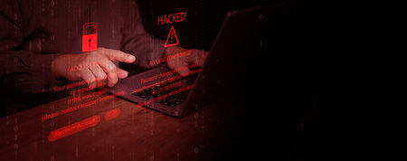 A man with his laptop and hacking warning, unauthorized login detection on digital interface. Password breach, account compromise, identity theft, cybersecurity threat, data stealing, online fraud.の写真素材