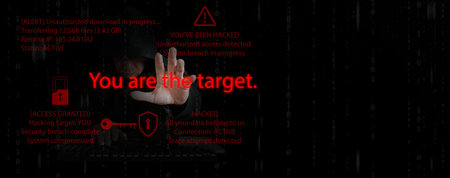 Cybersecurity concept. Hacker reaching his hand with text saying you are the target. Hacking alert...