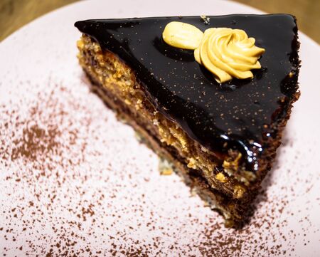 a piece of chocolate cake with nuts