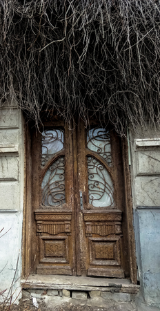 the marvel of architecture old wooden door of the houseの写真素材