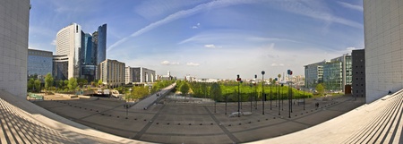 PARIS FRANCE - APRIL 14: Business district La Defense April 14, 2011 in Paris, France. View of Paris from the steps of the Grand Arch. Green Park against the blue sky. La Defense - Modern business and residential district in the near suburb of Paris, westのeditorial素材