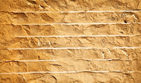 Close up of a brick-wall, texture background. Pattern gray color of cracked real stone wall surface...