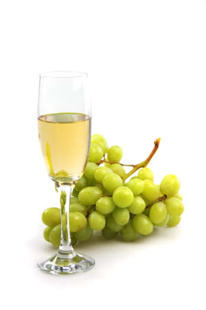 glass of white wine and grapes on a white backgroundの写真素材