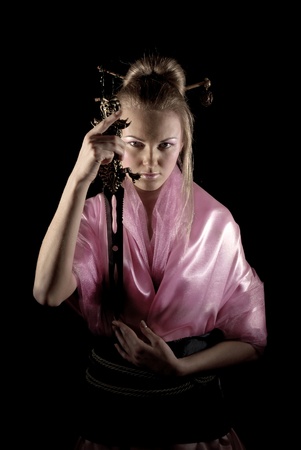 Girl dressed in Oriental style with a daggerの写真素材
