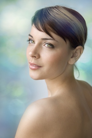 Portrait of a young beautiful girl. She tenderly looks away and smiles slightly. Day make-up.の写真素材