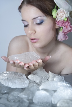 The beautiful young girl in a role of spring which kindles winter iceの写真素材