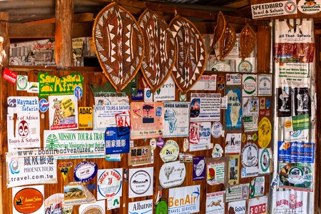 Masai Mara, Kenya - 03 January: Billboard in the gift shop for tourists January 3, 2013 in Masai Mara, Kenya.のeditorial素材