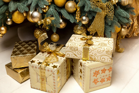 Christmas presents under the Christmas tree, gifts to the new 2016 Christmas surpriseの写真素材