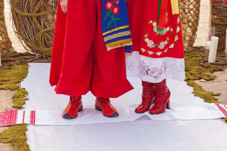 a wedding bouquet is in the hands of fianceeの写真素材