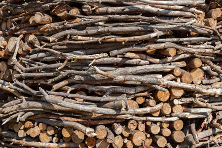 the chopped firewoods are neatly put, supply of firewoods on a winter
