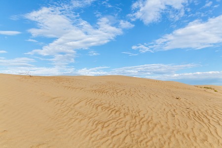 Sandy desert.Sandy desert landscape, dunes, with blue sky on the background.の写真素材