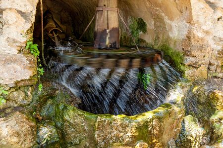 Water Mill. Water mill Fyakkati Fiaccati located in the rock. Thanks to high pressure water mill as quickly rotates and accelerates large water flows.の写真素材