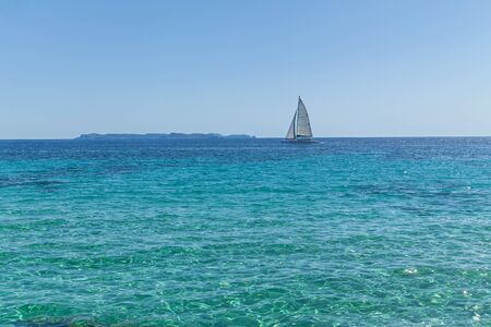 Sailing ship. Beautiful new sailing ship in an open Mediterranean sea against clear blue sky.の写真素材