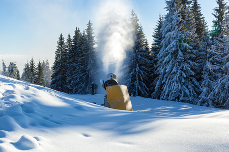 Snow blower. Yellow snow blower in Bukovel resort, Carpathians.の写真素材