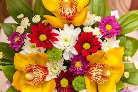 Bouquet for the holiday. Flower bouquet composition of different flowers in wooden box.の写真素材