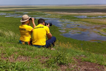 Amboseli, Kenya  10 January 2013 tourists look and take pictures landscape in Amboseli National Park
