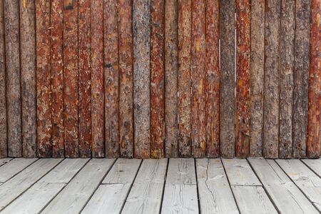 Wooden wall. Vintage old wall made of brown and red wooden planks on the boards. の写真素材