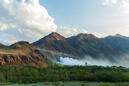 Bartogai dam on a mountain river Chilik, Kazakhstan upcast of waterの写真素材