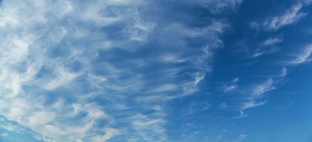blue sky background with tiny white  cloudsの写真素材
