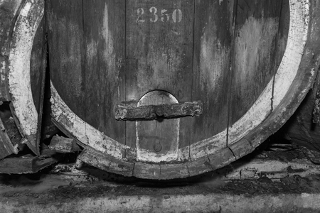 broken old oak barrels,An old wine cellar with oak barrels,barrels for wine in old cellarsの写真素材