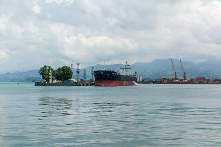 Georgia Batumi June 25, 2017 the ship is parked in the water area of the port and yachts of the club of the city of Batumi in the afternoon. Georgia, Adjara, Batumi,のeditorial素材
