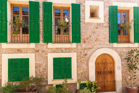 Green shutters on the house, to protect against external damage. Green shutters.Palma de Mallorca house.の写真素材