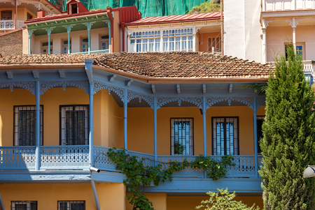 Houses in Tbilisi, Georgia, yellow house with blue balconies. Houses in Tbilisi, Georgia.の写真素材